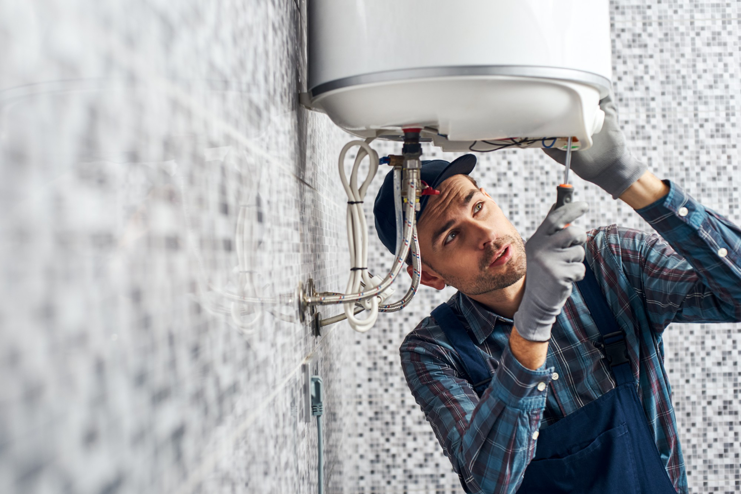 Technician installing a water heater